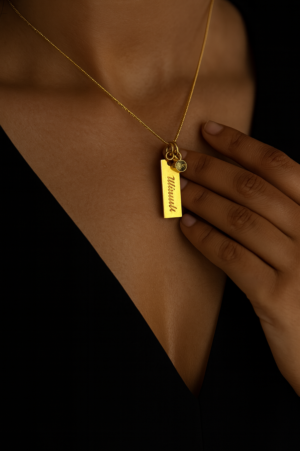 Engraved plate name necklace with green birthstone charm on gold finish—972 sterling silver, customizable chain length.