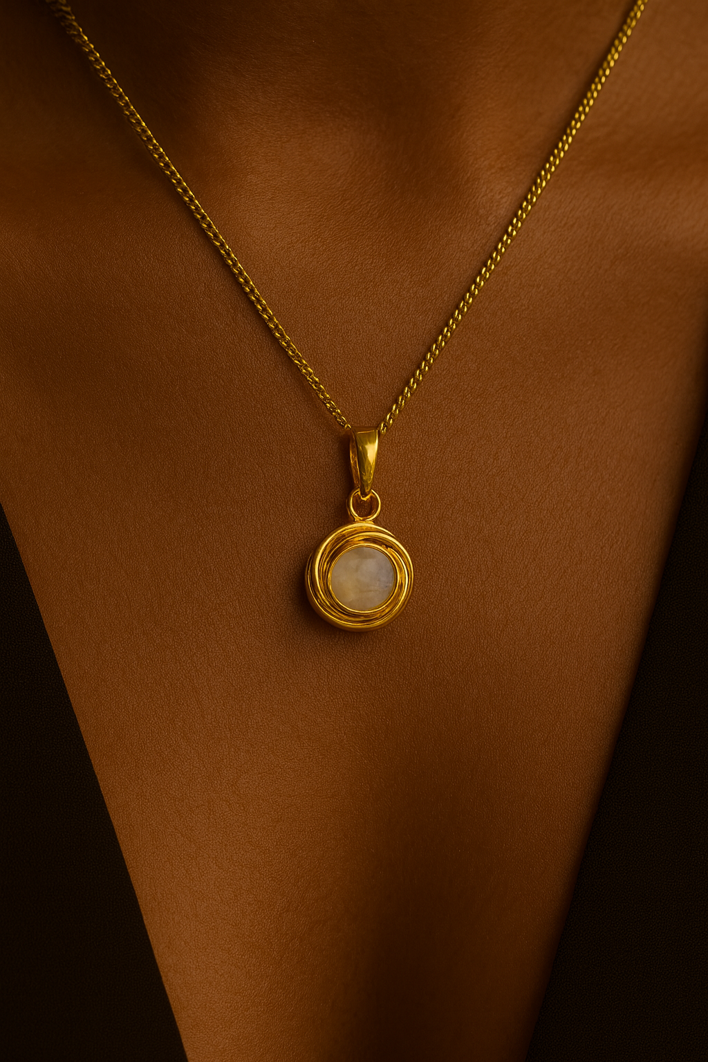 Angel Pearl Necklace in sterling silver with gold finish on model’s collarbone—dainty pearl pendant with customizable chain length.