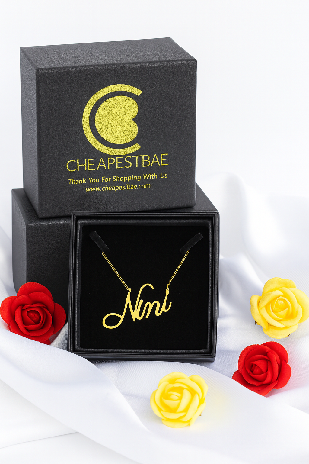 Custom name necklace in gold finish displayed in gift box—handmade 925 sterling silver with customizable chain length and font style.